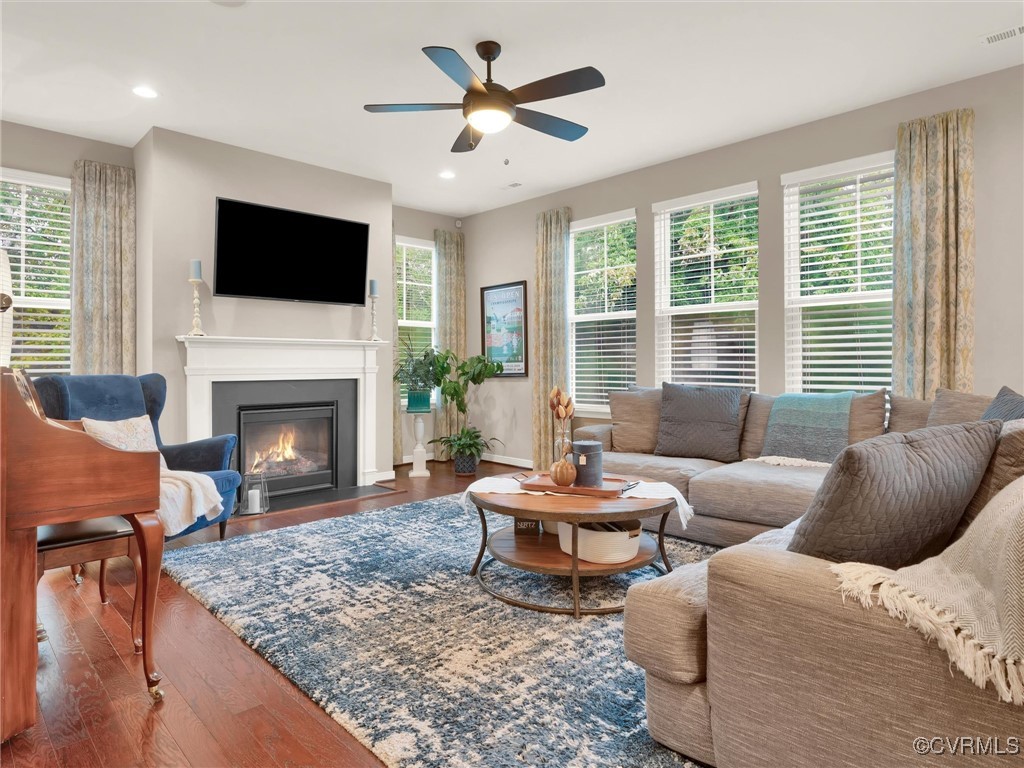 10168 Kellys Bluff Run Ashland, VA 23005 - Photo 9 of 50 a living room with furniture a flat screen tv and a fireplace