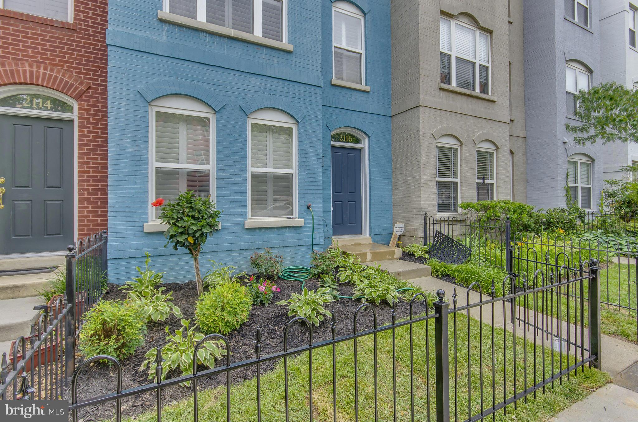 2116 12th Street Northwest Washington, DC 20009 - Photo 2 of 30 a front view of a house with a garden