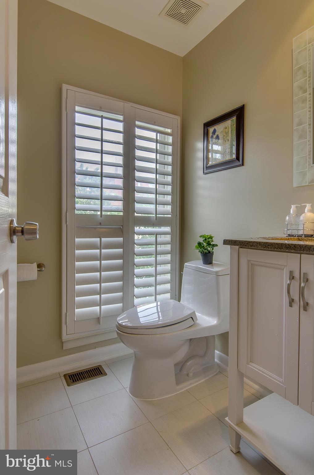 2116 12th Street Northwest Washington, DC 20009 - Photo 12 of 30 a living room with furniture and window
