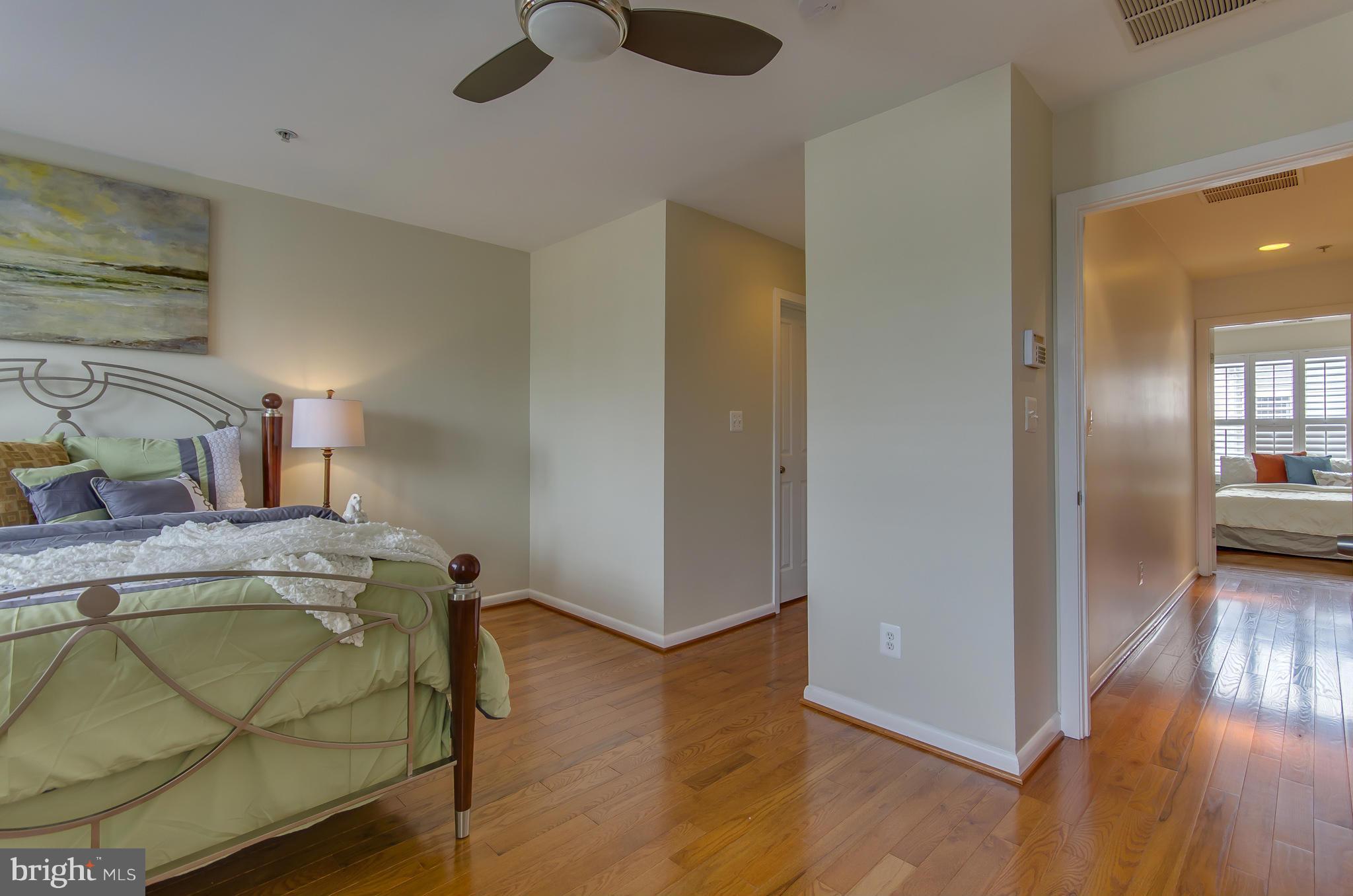 2116 12th Street Northwest Washington, DC 20009 - Photo 13 of 30 a bedroom with a bed and wooden floor