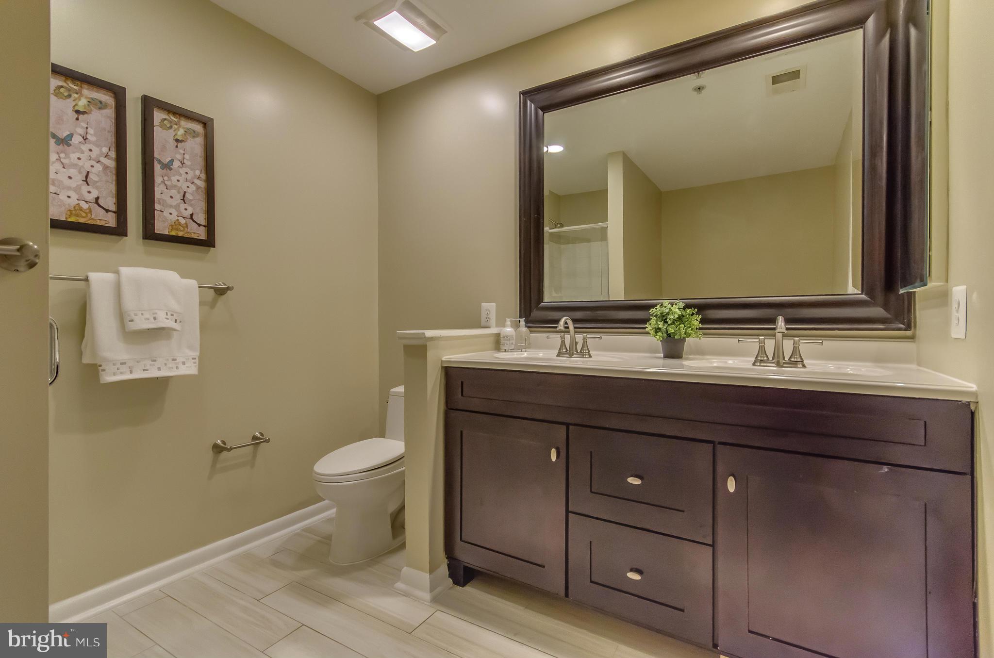 2116 12th Street Northwest Washington, DC 20009 - Photo 16 of 30 a bathroom with a sink and a mirror