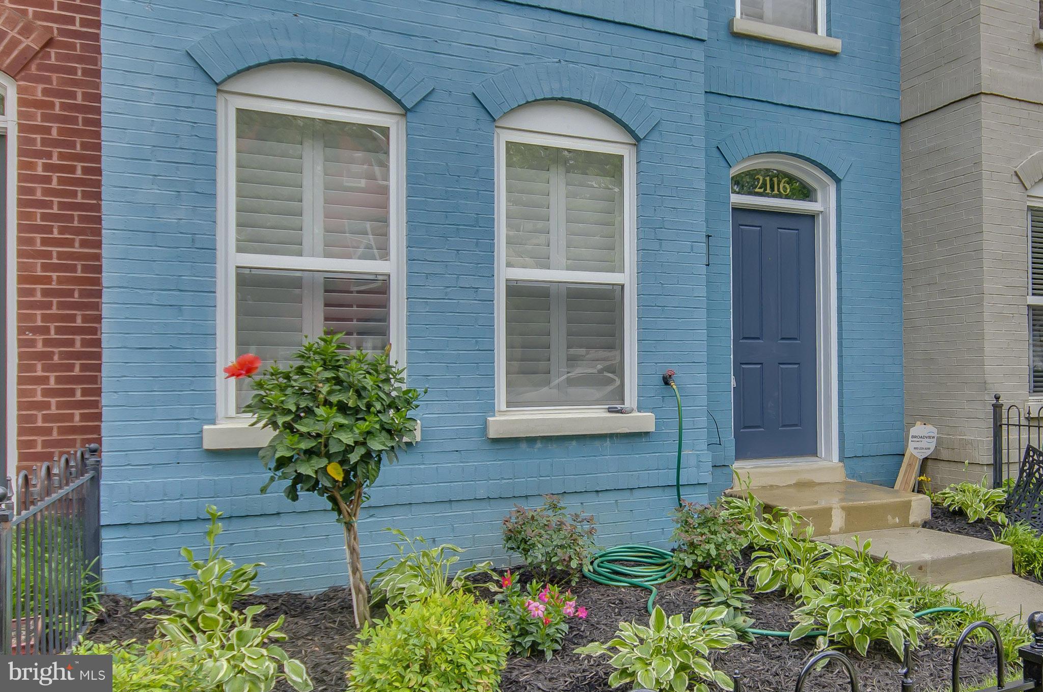 2116 12th Street Northwest Washington, DC 20009 - Photo 25 of 30 a front view of a house with a yard