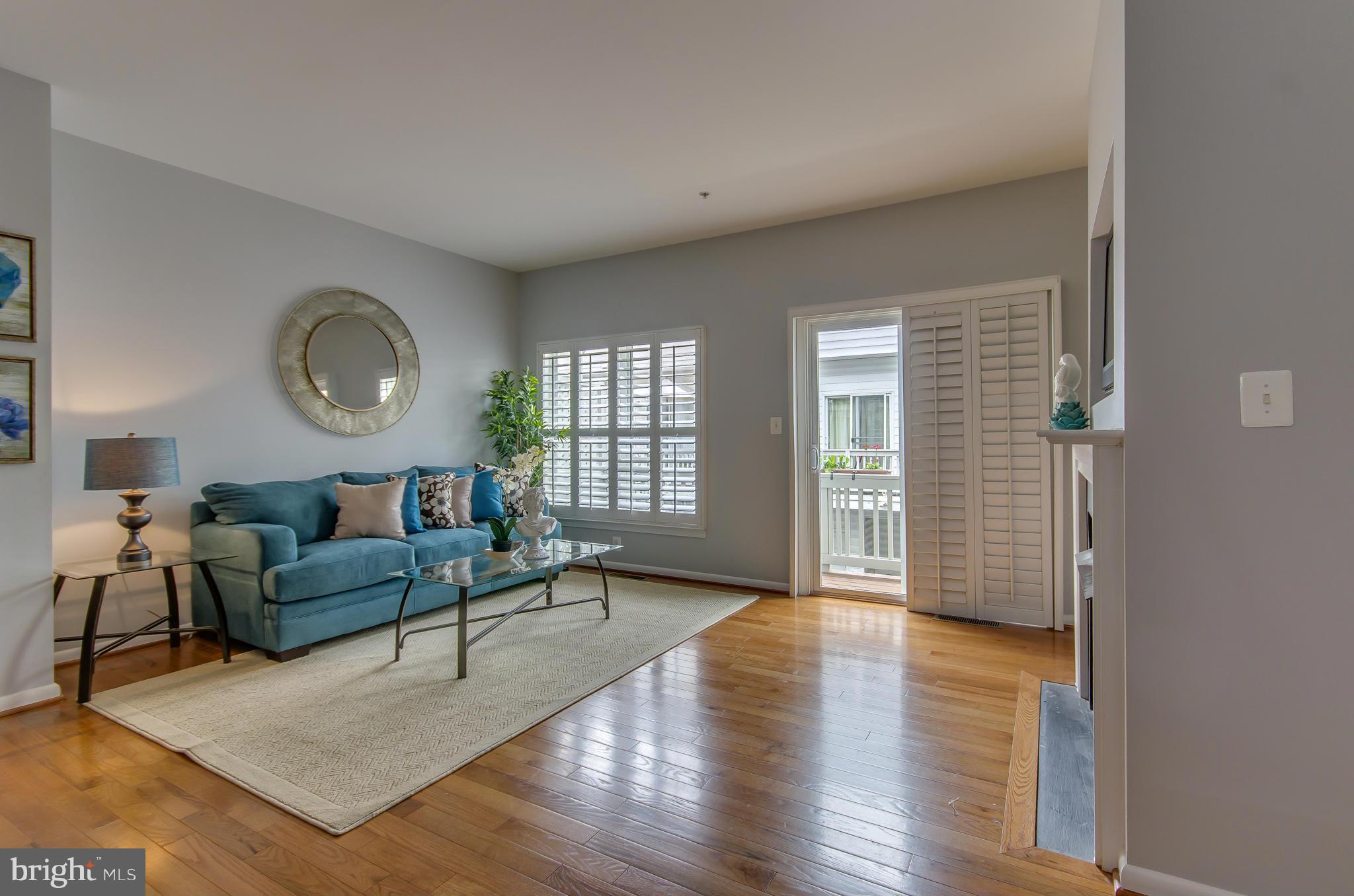 2116 12th Street Northwest Washington, DC 20009 - Photo 6 of 30 a living room with furniture and a wooden floor