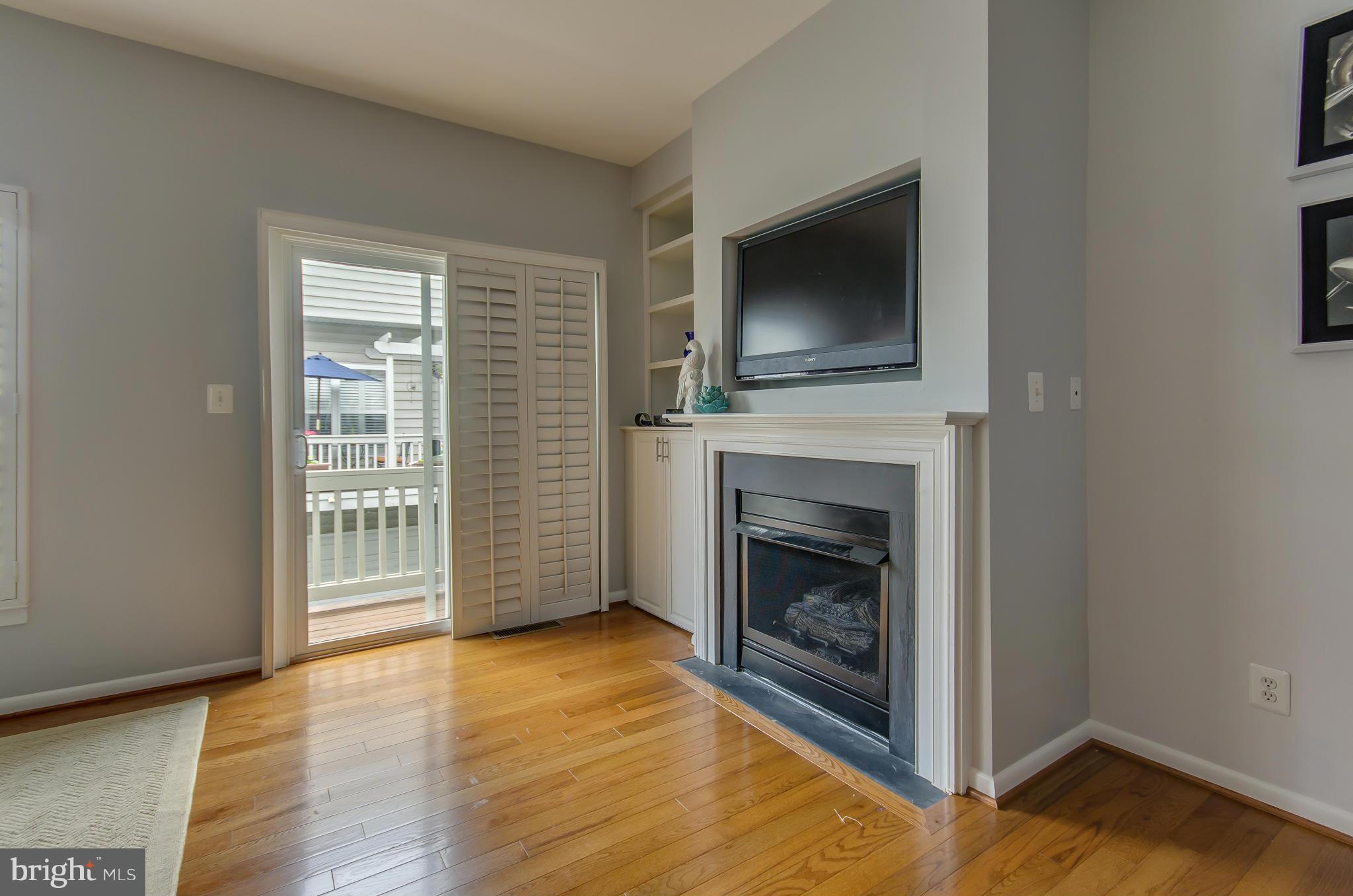 2116 12th Street Northwest Washington, DC 20009 - Photo 7 of 30 a view of a livingroom with an empty space and a fireplace