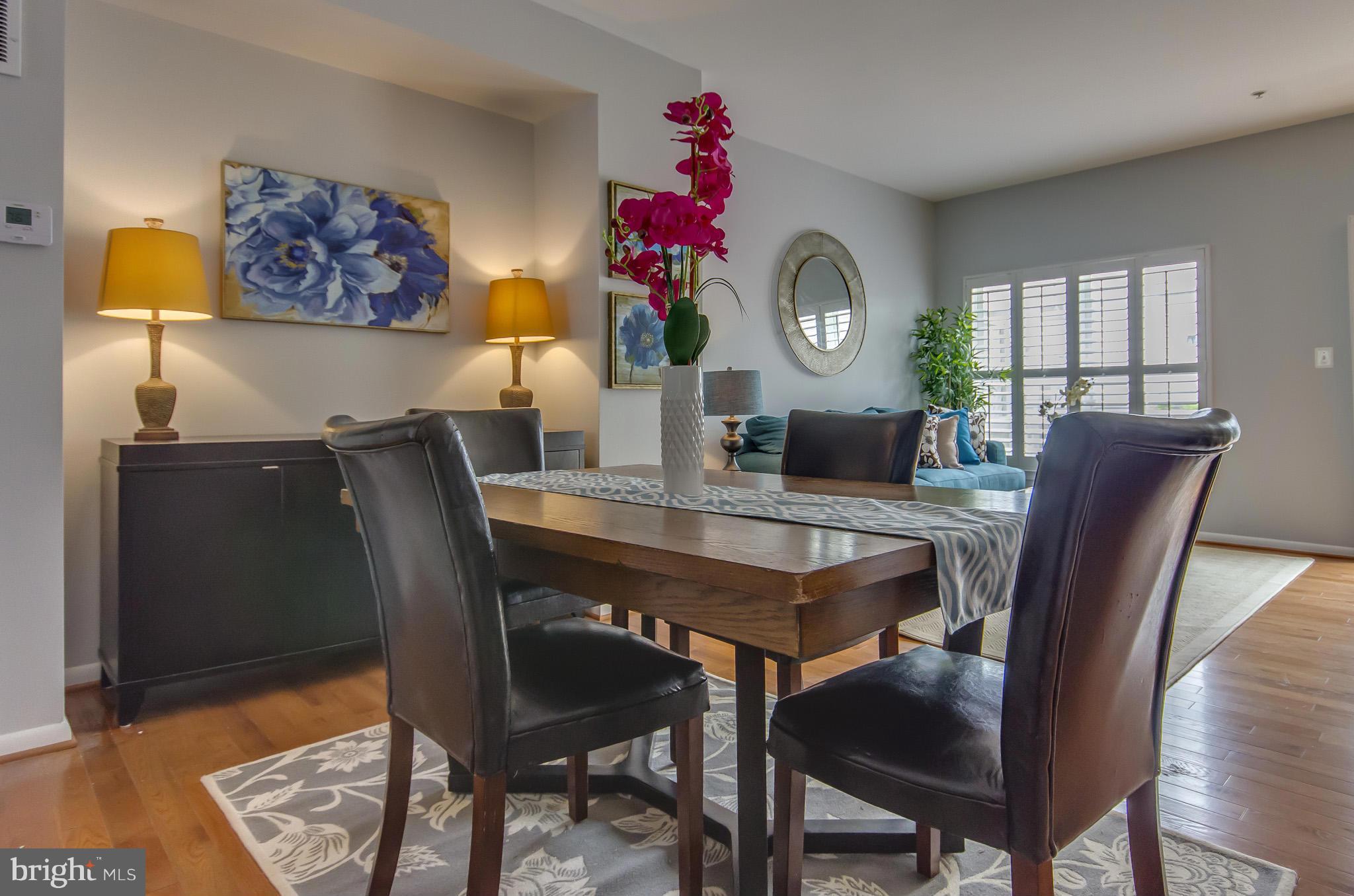 2116 12th Street Northwest Washington, DC 20009 - Photo 8 of 30 a view of a dining room with furniture and a chandelier