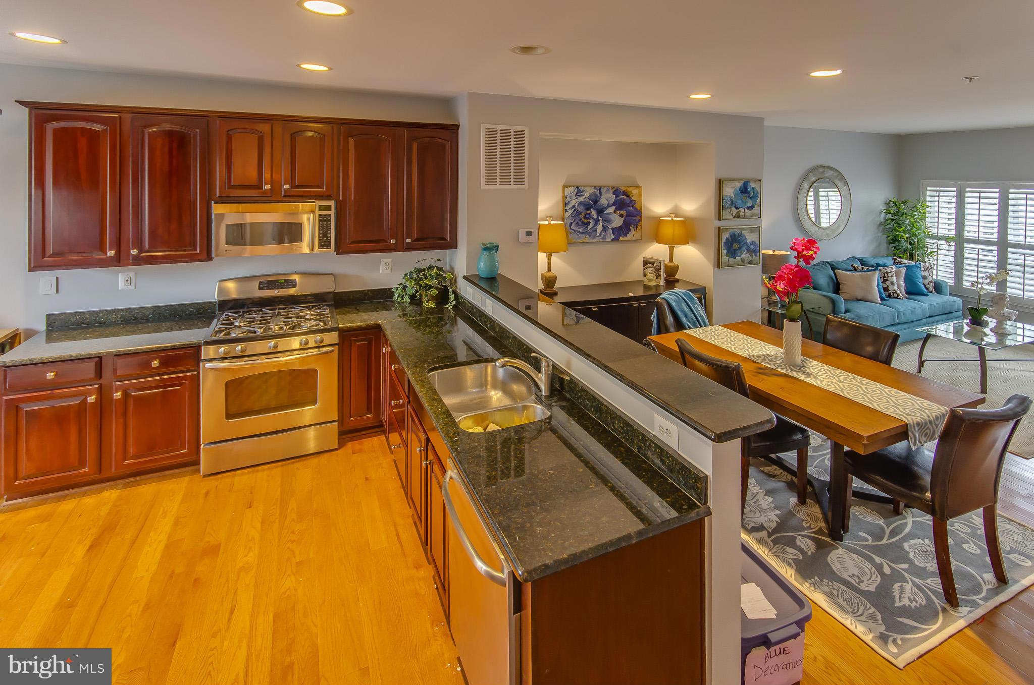2116 12th Street Northwest Washington, DC 20009 - Photo 9 of 30 a kitchen with a stove a sink and a refrigerator