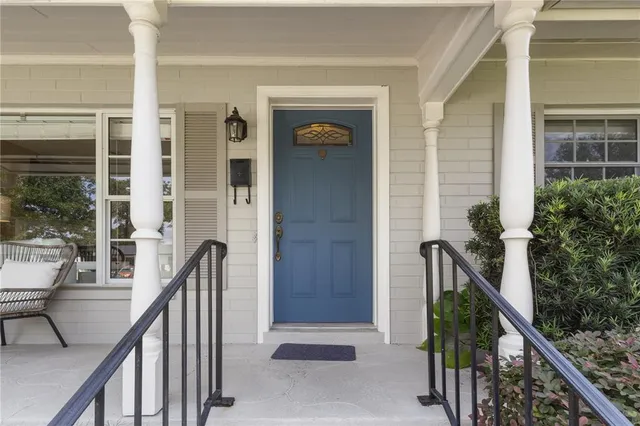 a view of a chair and table in the balcony