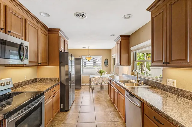 a kitchen with a sink and a window