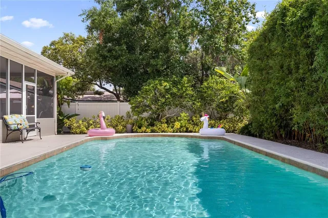 a view of a house with backyard and porch