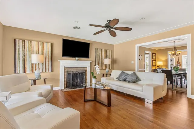 a living room with fireplace furniture and a flat screen tv