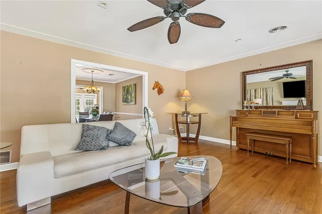 a view of a dining room with furniture wooden floor and chandelier