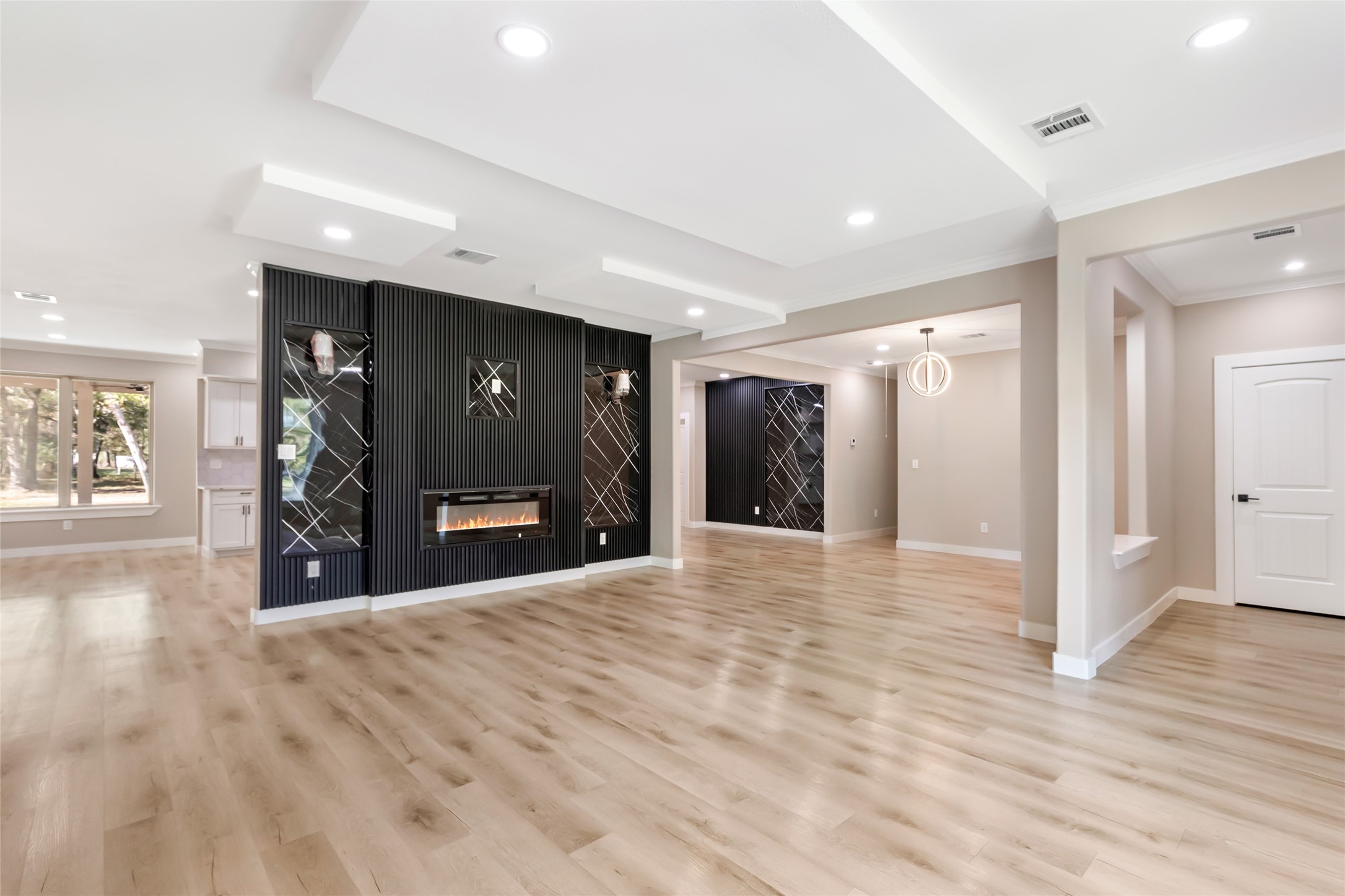 26707 Apache Trail Magnolia, TX 77354 - Photo 11 of 37 a view of a hallway with wooden floor and livingroom with furniture