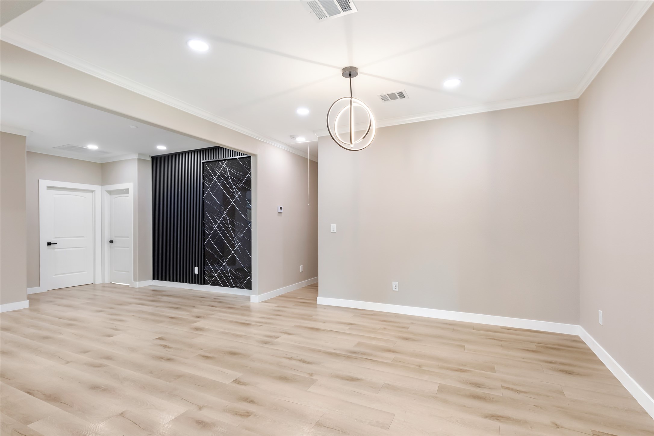 26707 Apache Trail Magnolia, TX 77354 - Photo 14 of 37 a view of an empty room with wooden floor and white walls