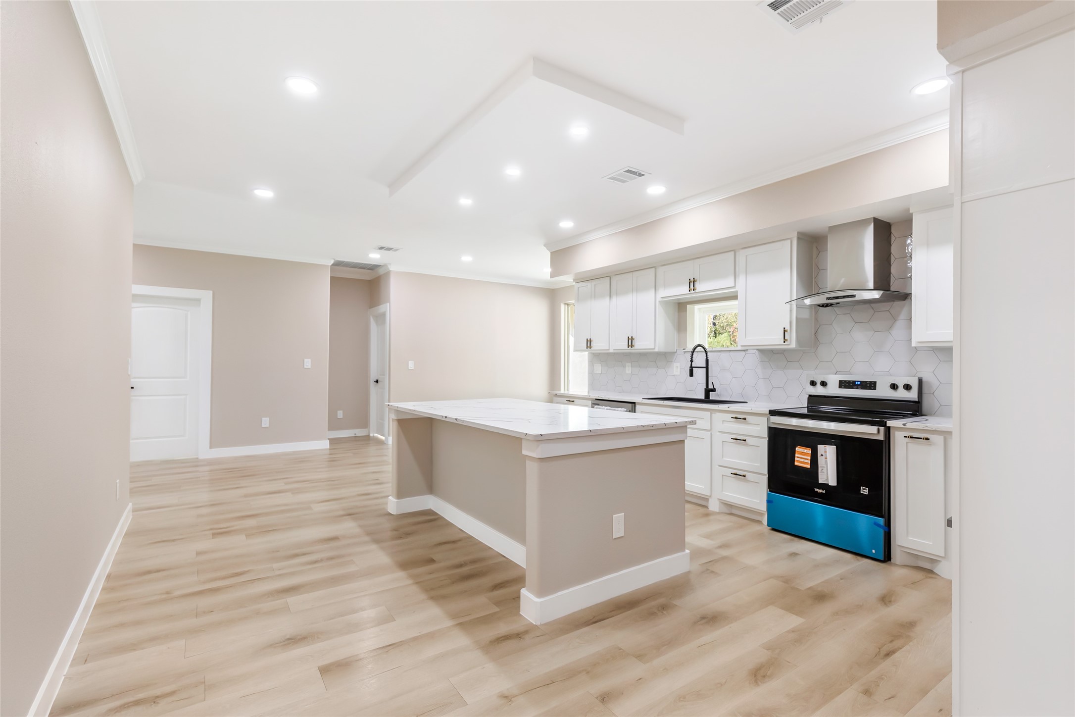 26707 Apache Trail Magnolia, TX 77354 - Photo 17 of 37 a large kitchen with stainless steel appliances granite countertop a stove and a sink