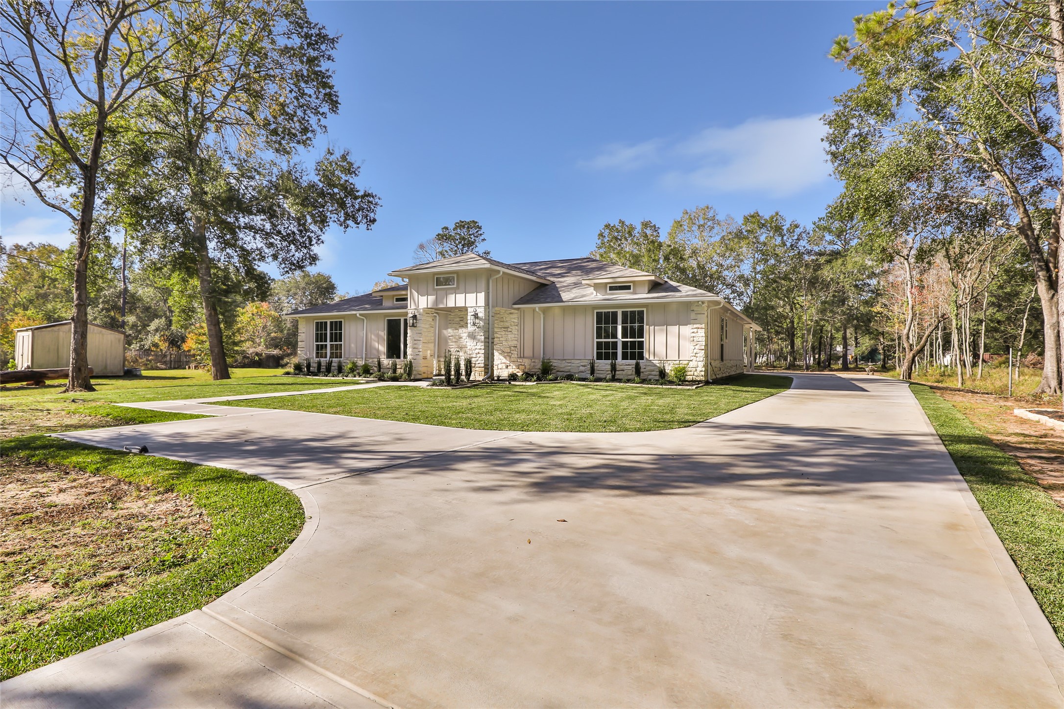 26707 Apache Trail Magnolia, TX 77354 - Photo 2 of 37 a view of house with yard and palm tree