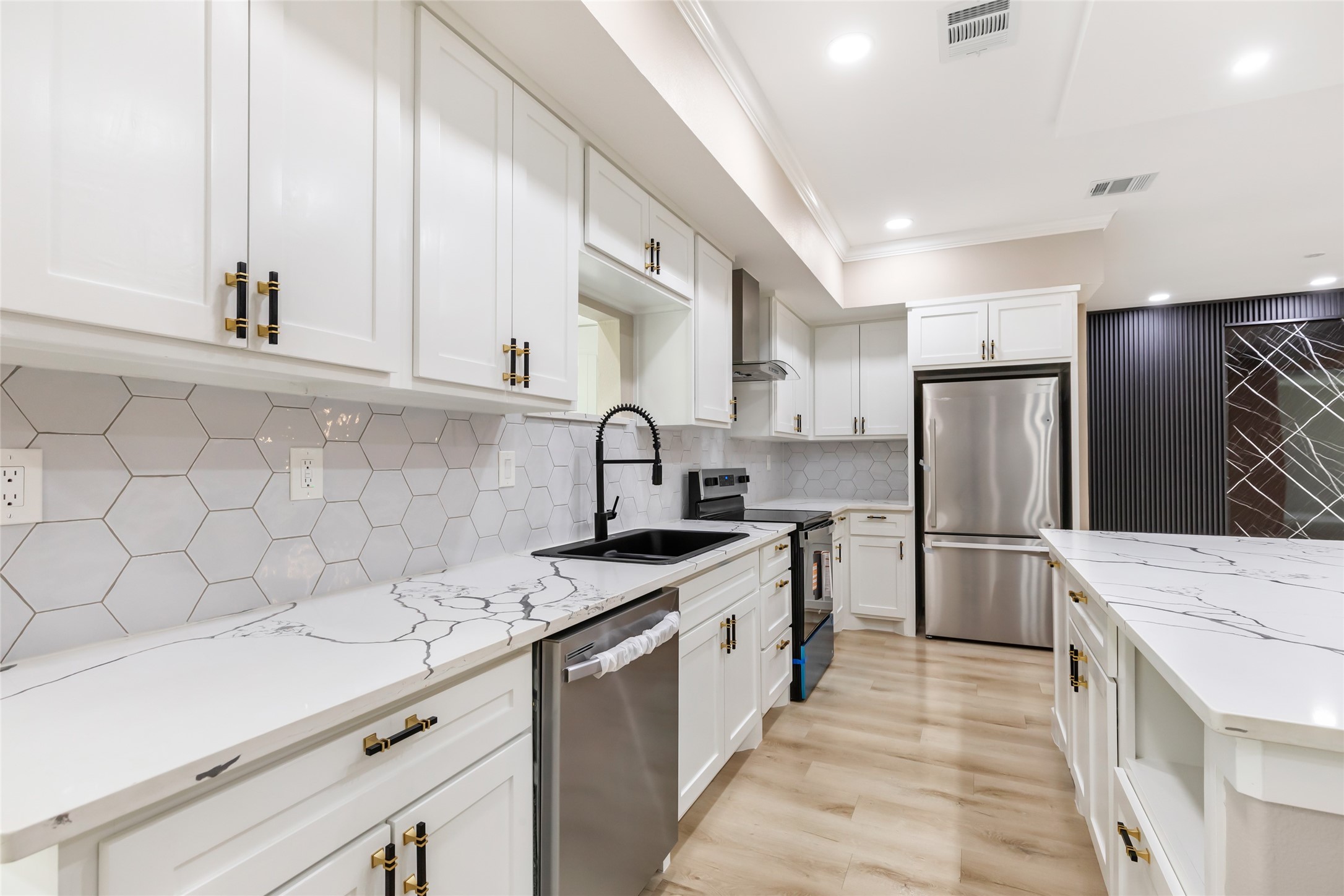 26707 Apache Trail Magnolia, TX 77354 - Photo 22 of 37 a kitchen with stainless steel appliances granite countertop a sink stove and refrigerator