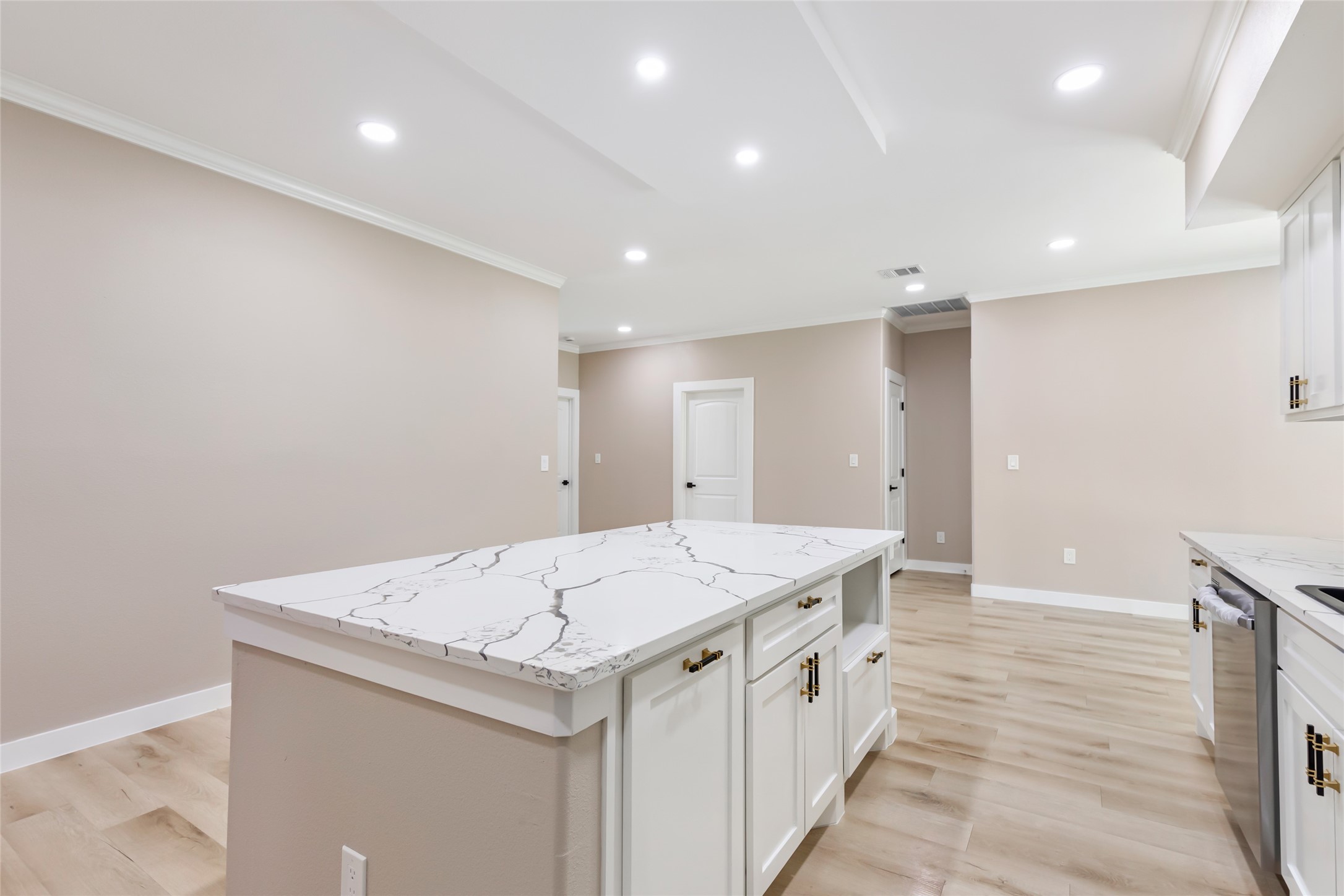 26707 Apache Trail Magnolia, TX 77354 - Photo 23 of 37 a large white kitchen with a sink and dishwasher
