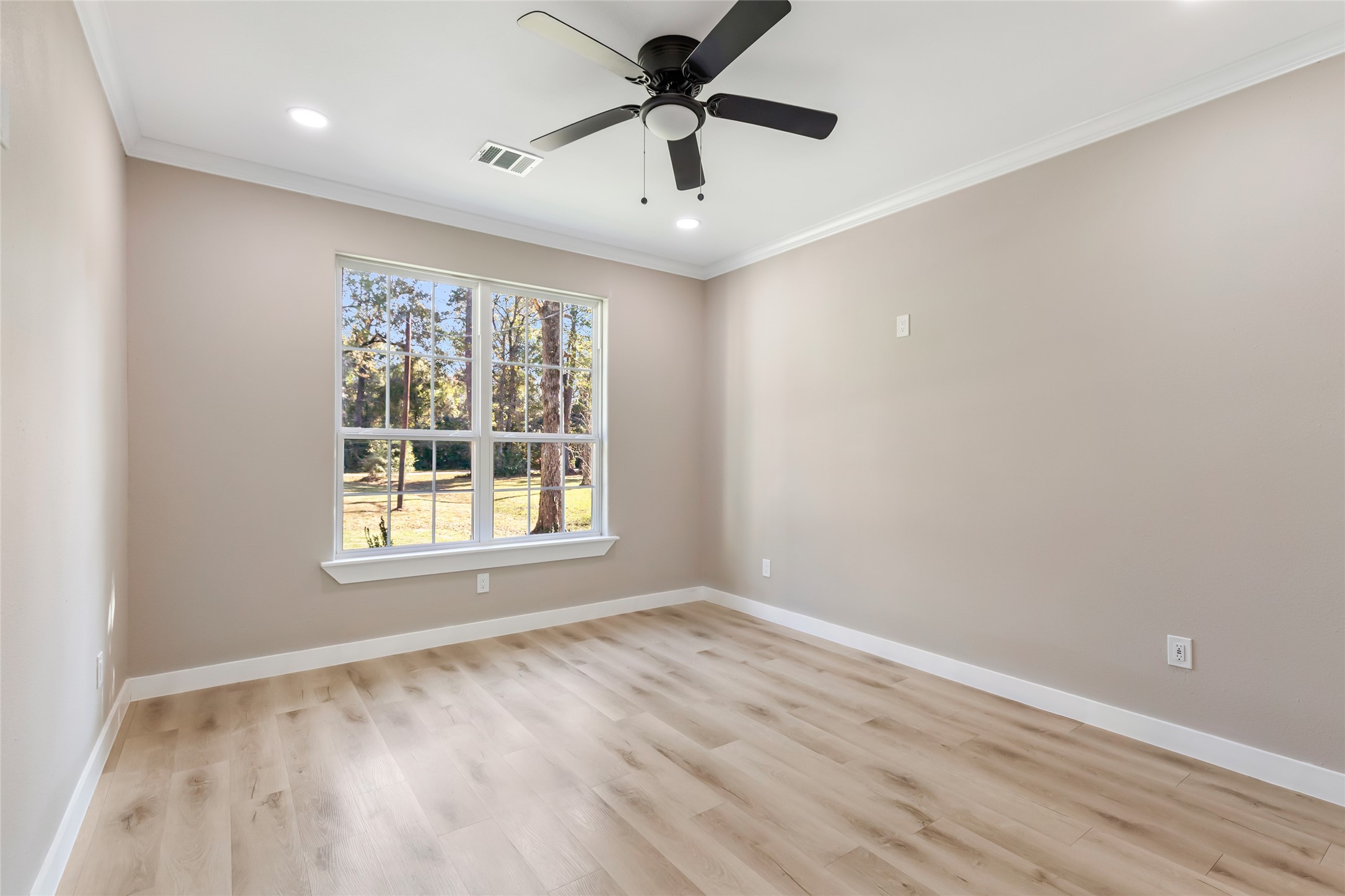 26707 Apache Trail Magnolia, TX 77354 - Photo 25 of 37 a view of a livingroom with a window and a ceiling fan