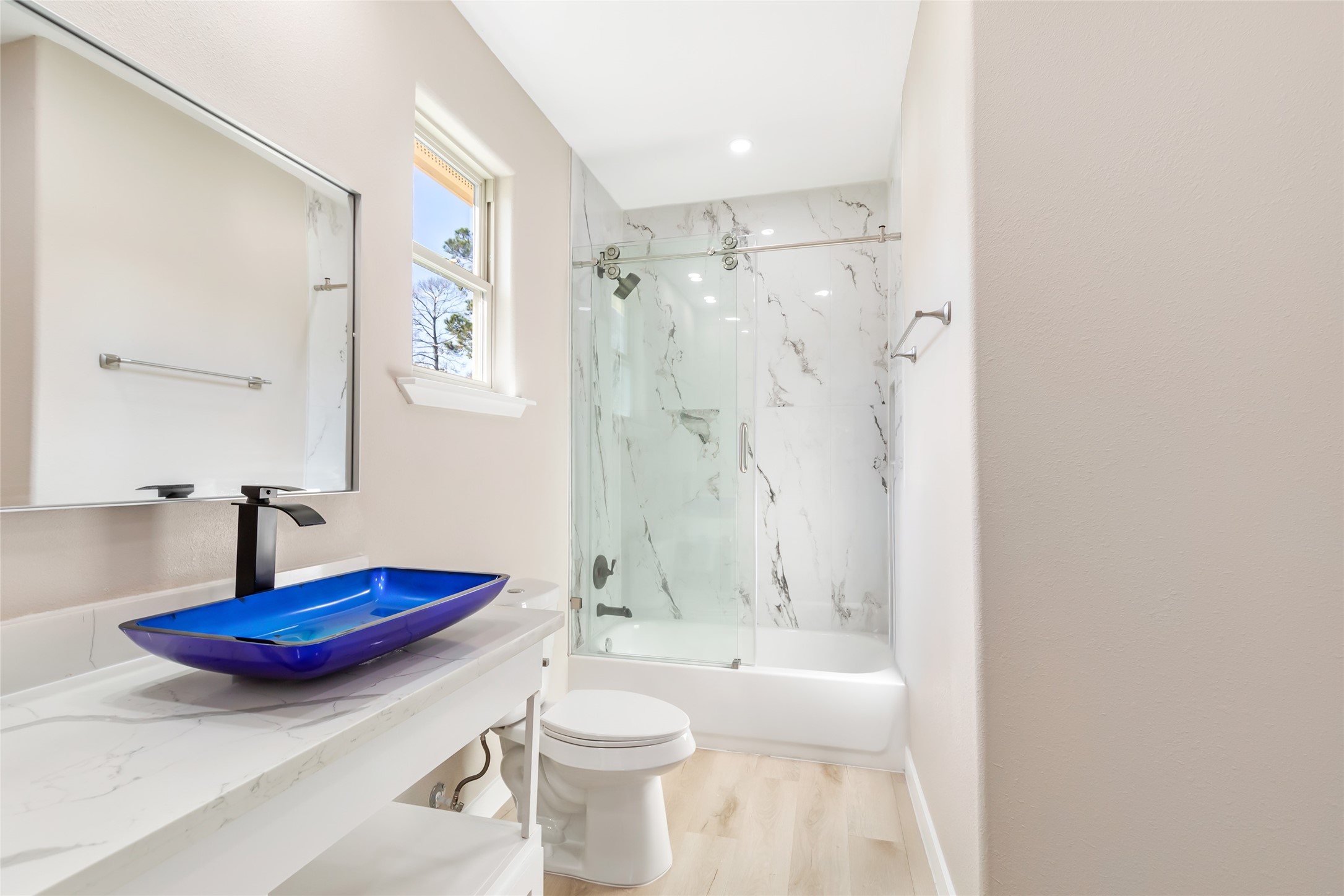 26707 Apache Trail Magnolia, TX 77354 - Photo 27 of 37 a bathroom with a sink a toilet and a shower