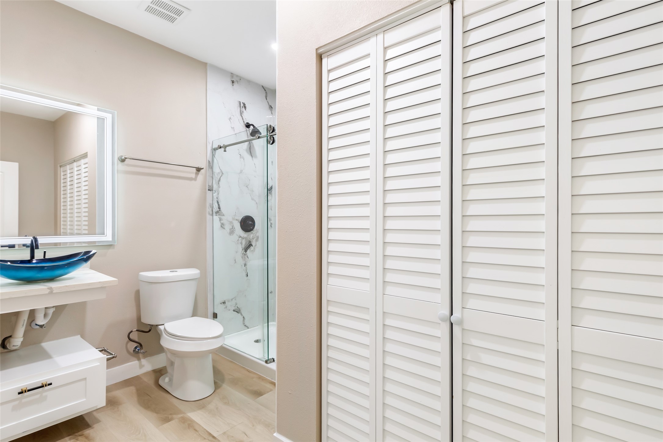 26707 Apache Trail Magnolia, TX 77354 - Photo 30 of 37 a white toilet sitting next to a bathroom sink