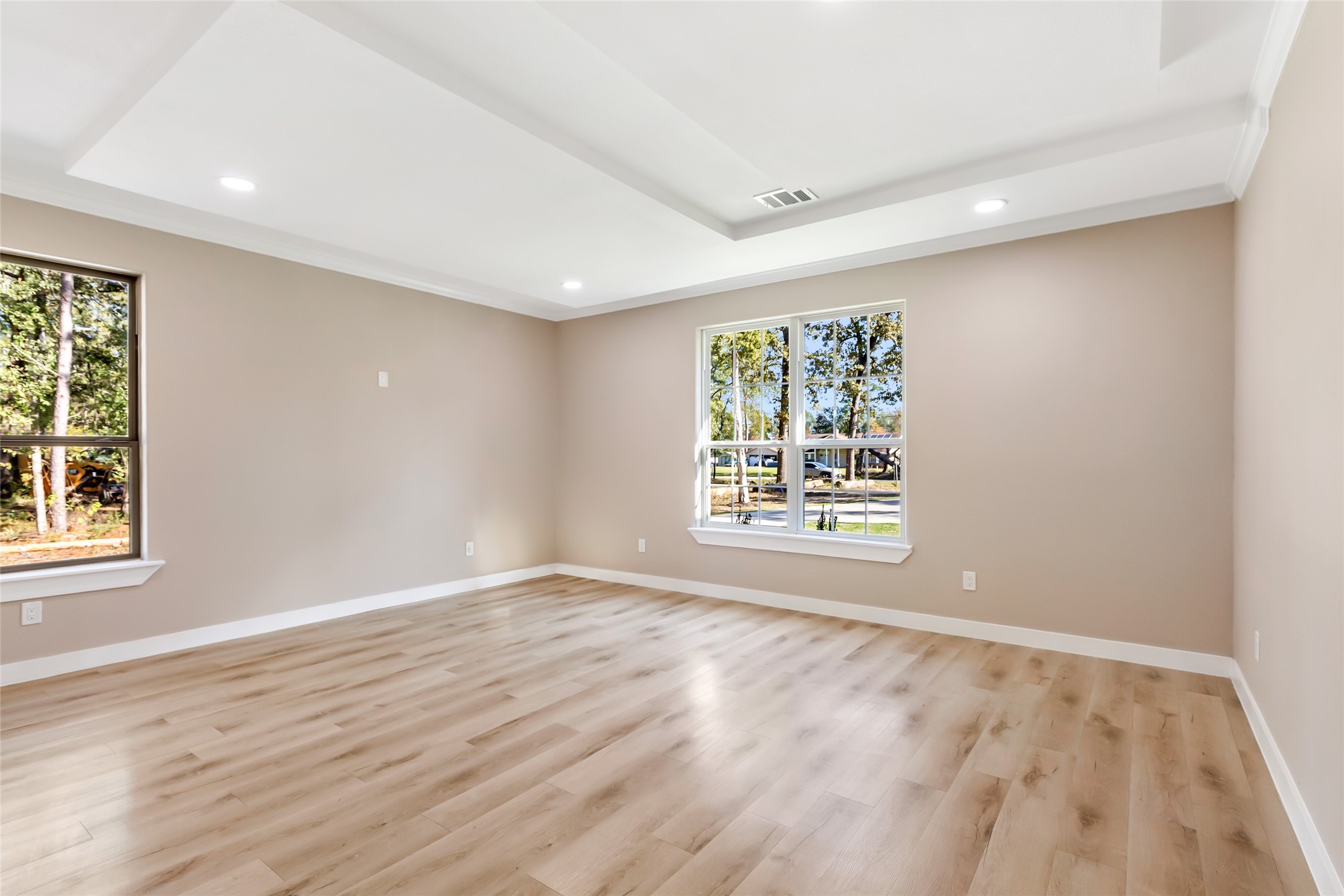 26707 Apache Trail Magnolia, TX 77354 - Photo 31 of 37 a view of an empty room with wooden floor and a window
