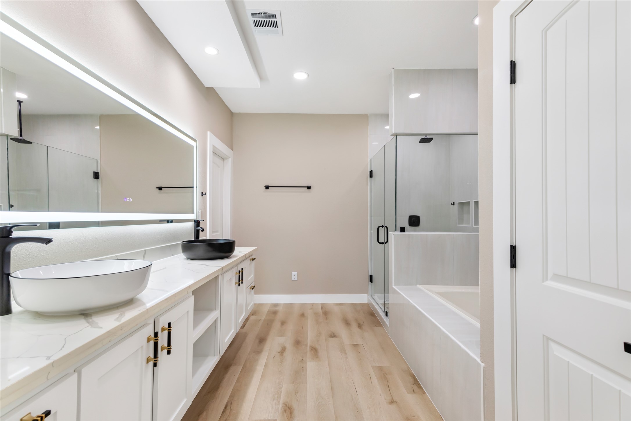 26707 Apache Trail Magnolia, TX 77354 - Photo 33 of 37 a bathroom with a granite countertop tub sink and a mirror