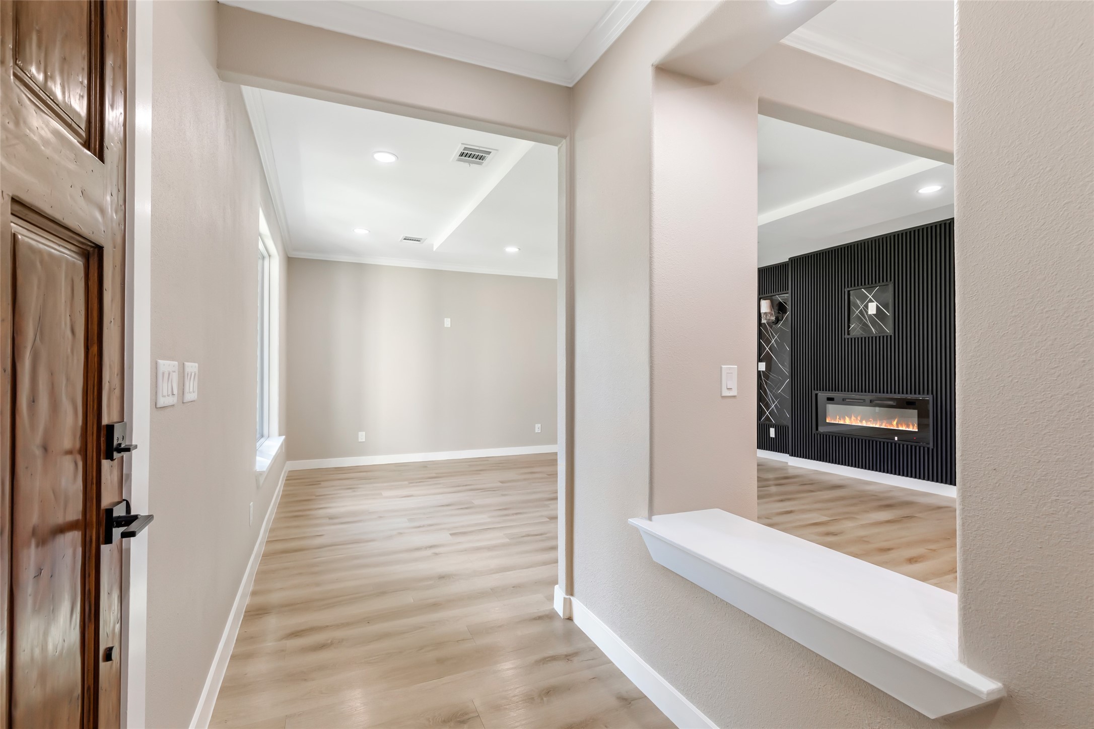 26707 Apache Trail Magnolia, TX 77354 - Photo 9 of 37 a view of a hallway with wooden floor and staircase