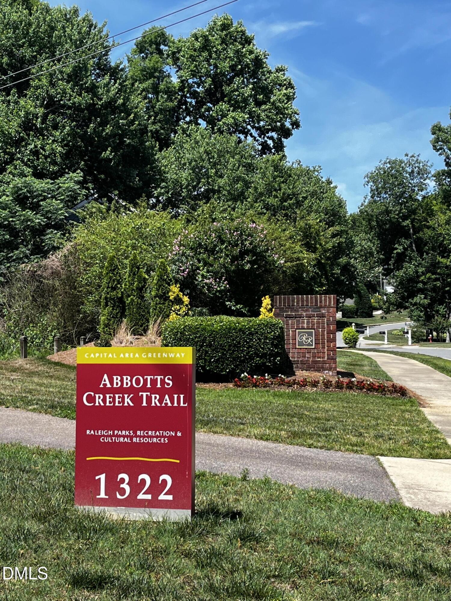 1427 Moosecreek Drive Raleigh, NC 27614 - Photo 48 of 51 a sign on the side of the road