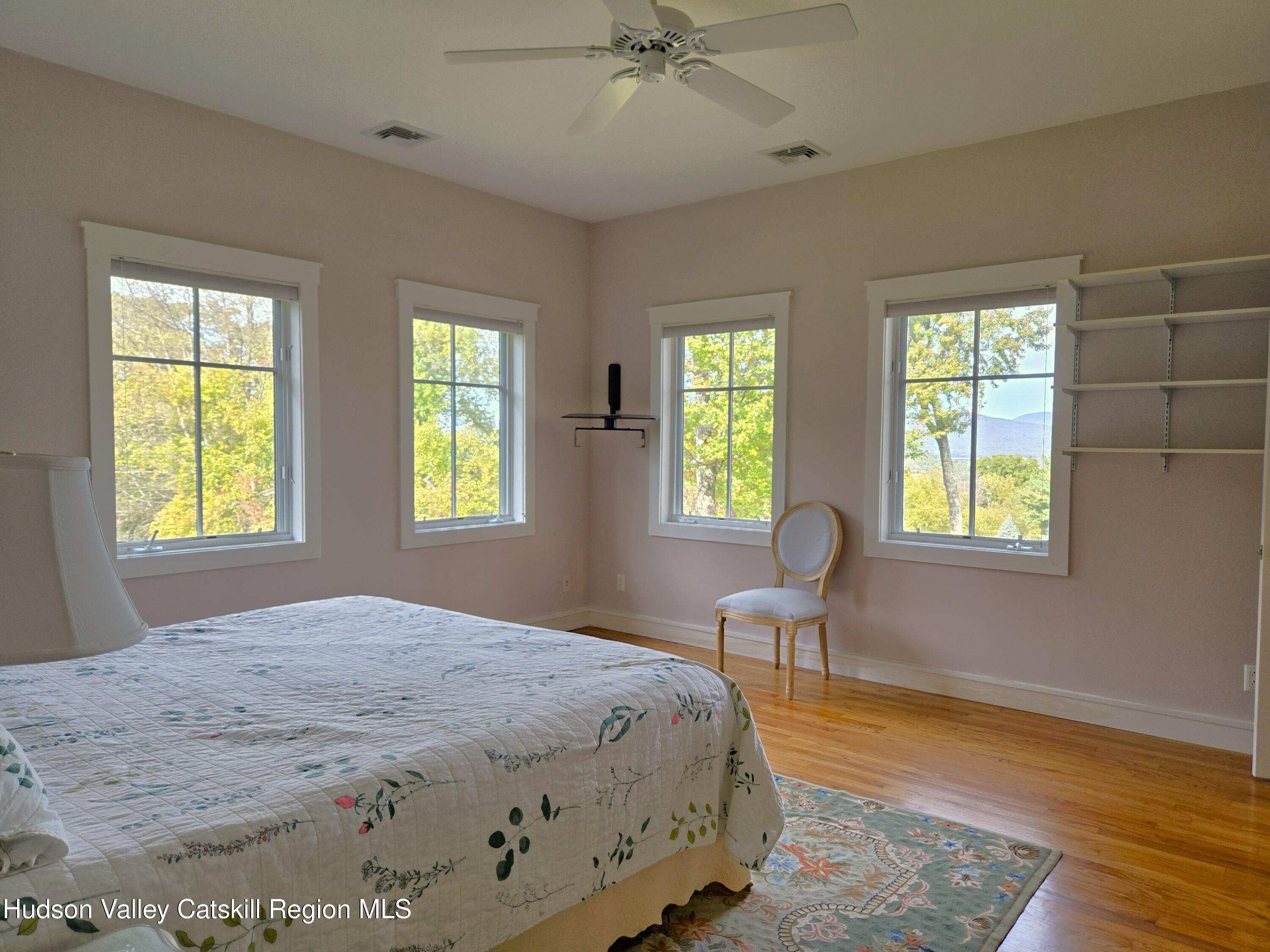 84 Highland Road Stone Ridge, NY 12484 - Photo 12 of 20 a spacious bedroom with a bed and a chair
