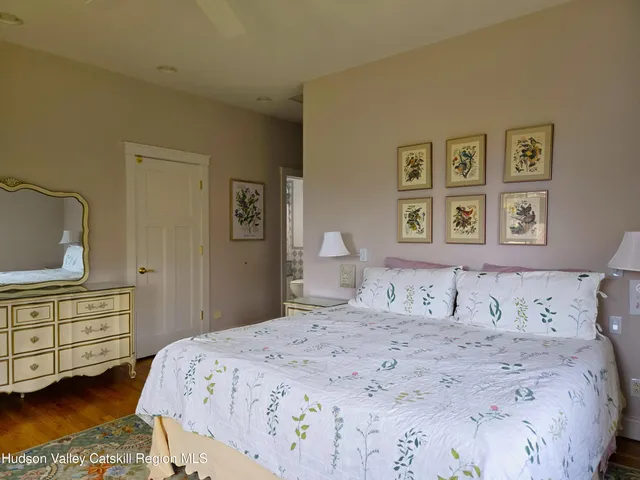 a bedroom with a bed and a dresser