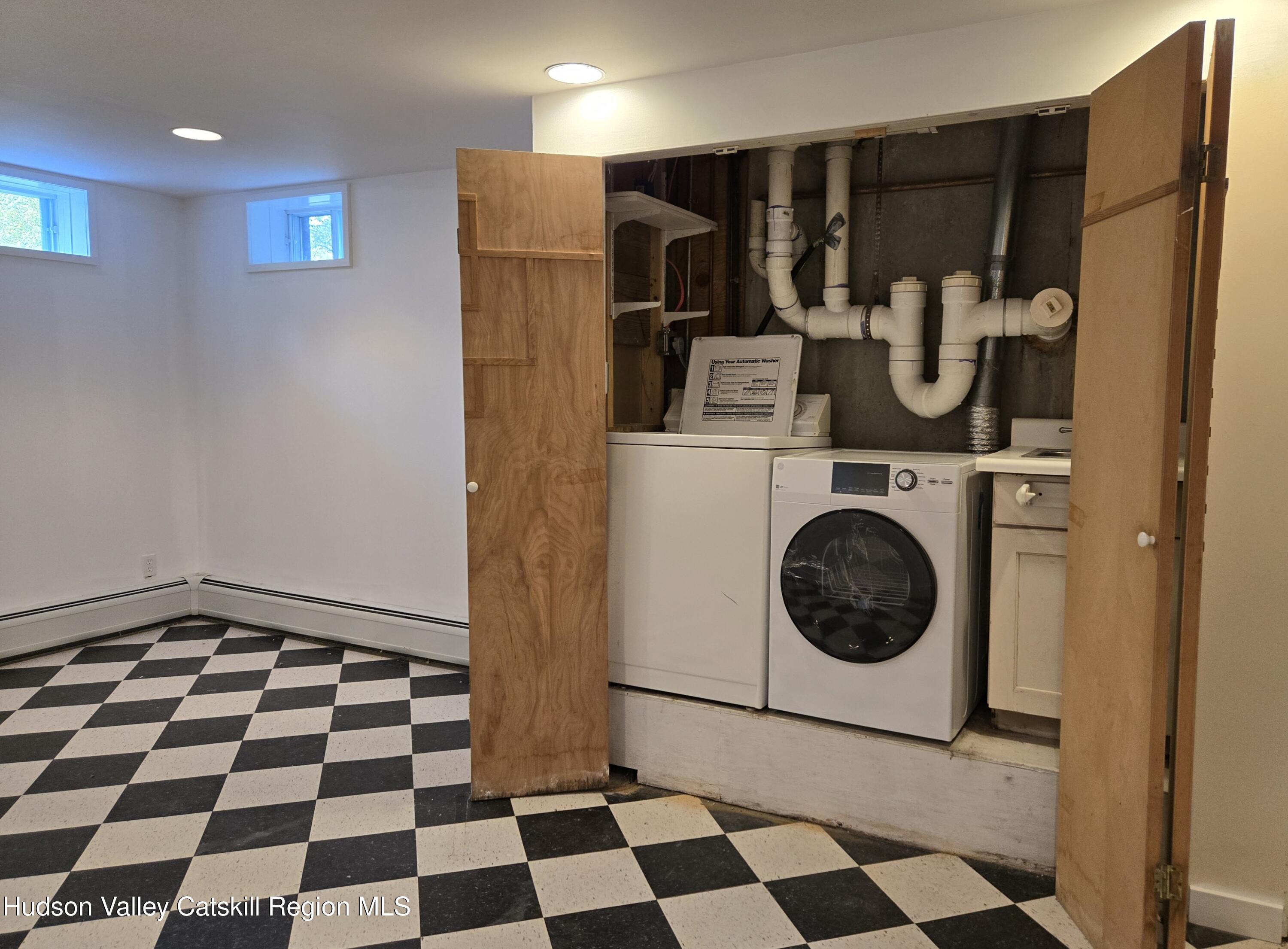 84 Highland Road Stone Ridge, NY 12484 - Photo 18 of 20 a room with a black white checkered floor and a black white checkered floor