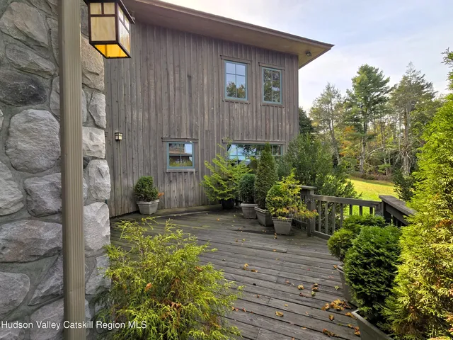 a view of a backyard with sitting area