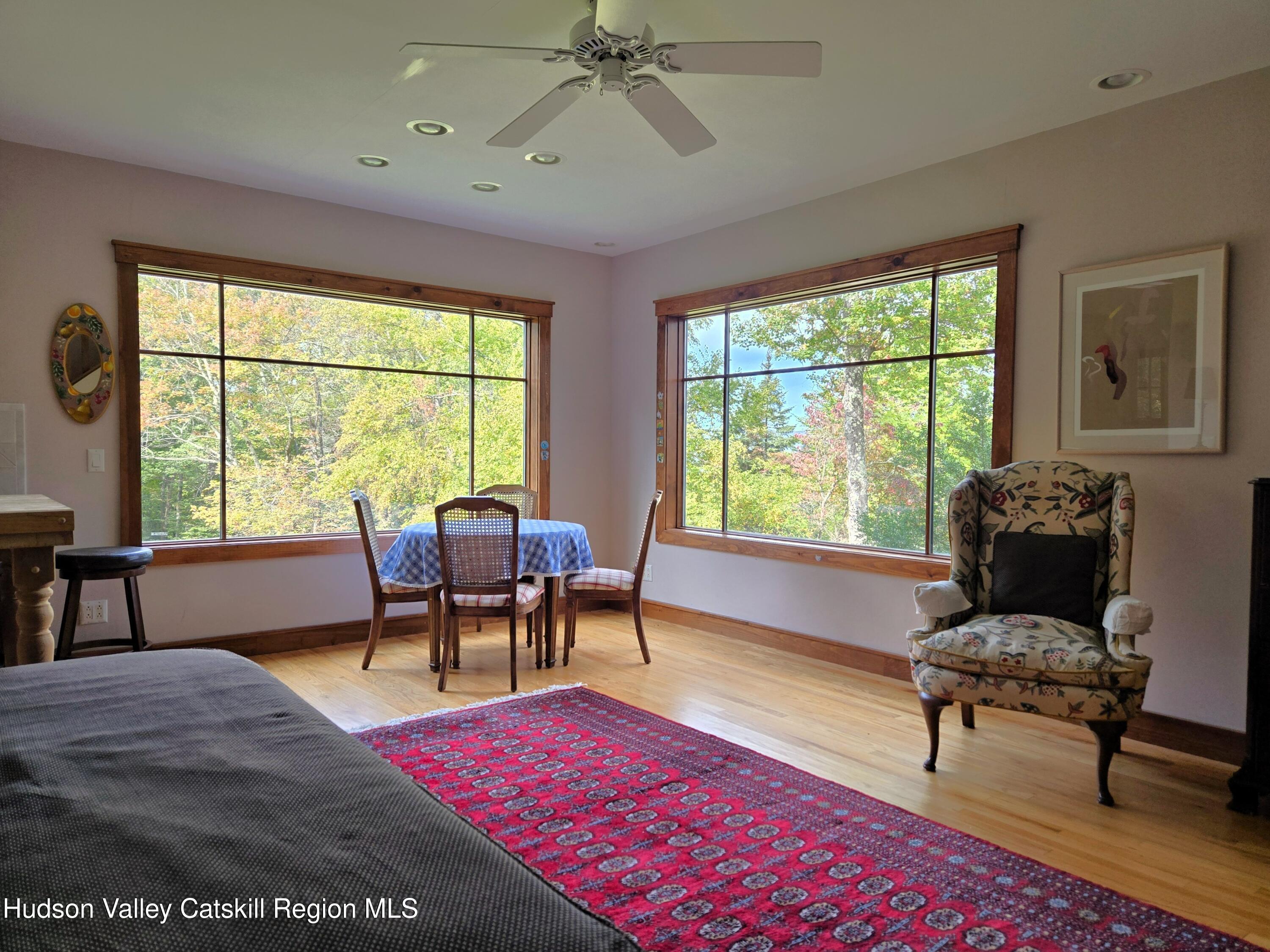 84 Highland Road Stone Ridge, NY 12484 - Photo 4 of 20 a living room with furniture a large window and a table