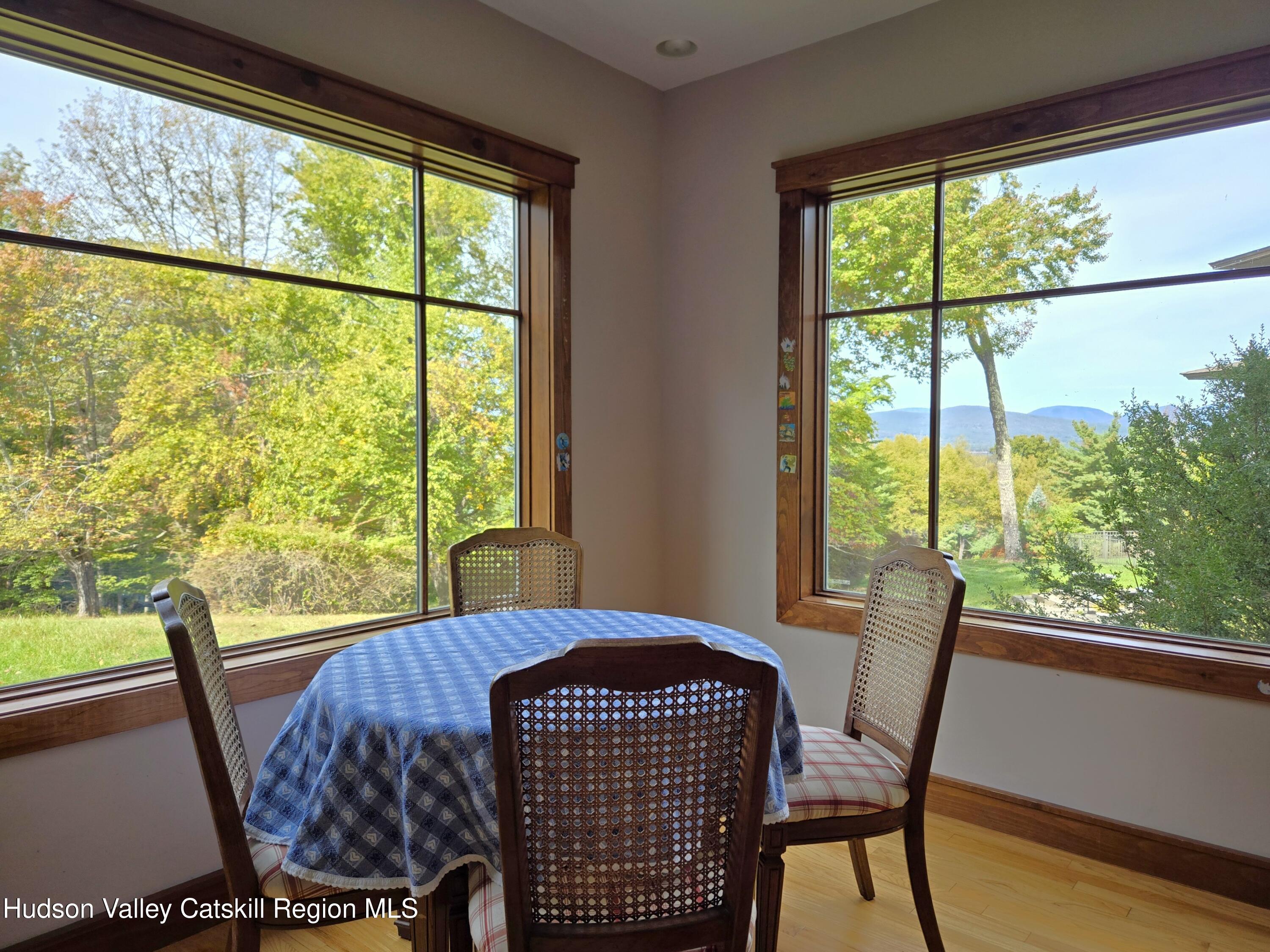 84 Highland Road Stone Ridge, NY 12484 - Photo 5 of 20 a view of a city from a dining room with large windows