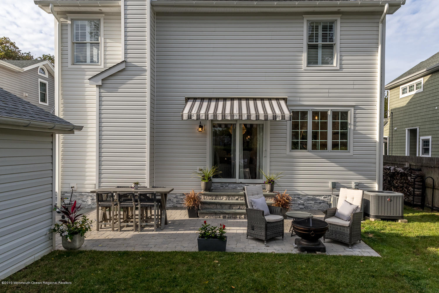 7 Lakeside Avenue Rumson, NJ 07760 - Photo 21 of 22 Paver Patio with Retractable Awning