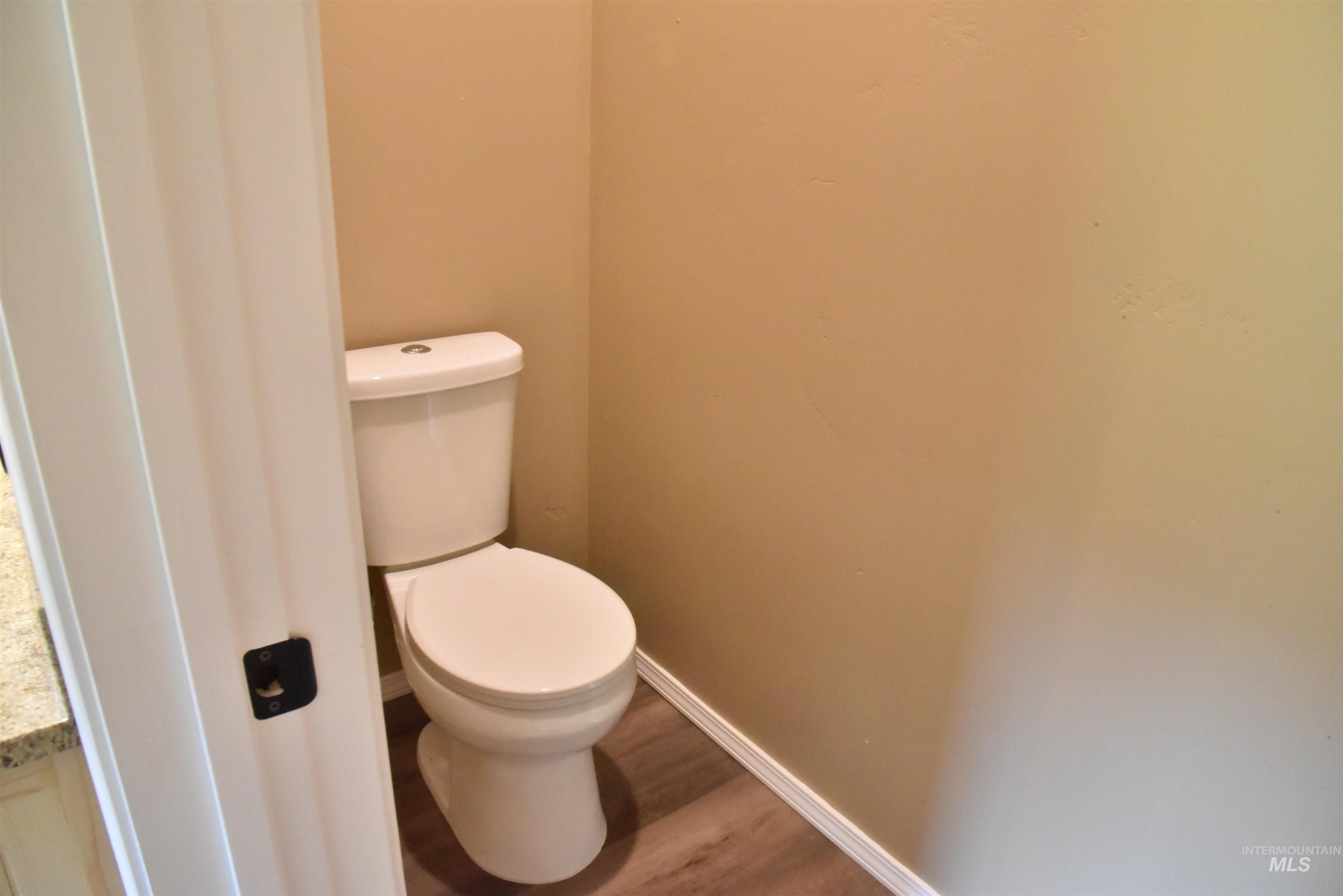 293 Vine Maple Desmet, ID 83824 - Photo 14 of 23 Bathroom featuring baseboards and wood finished floors