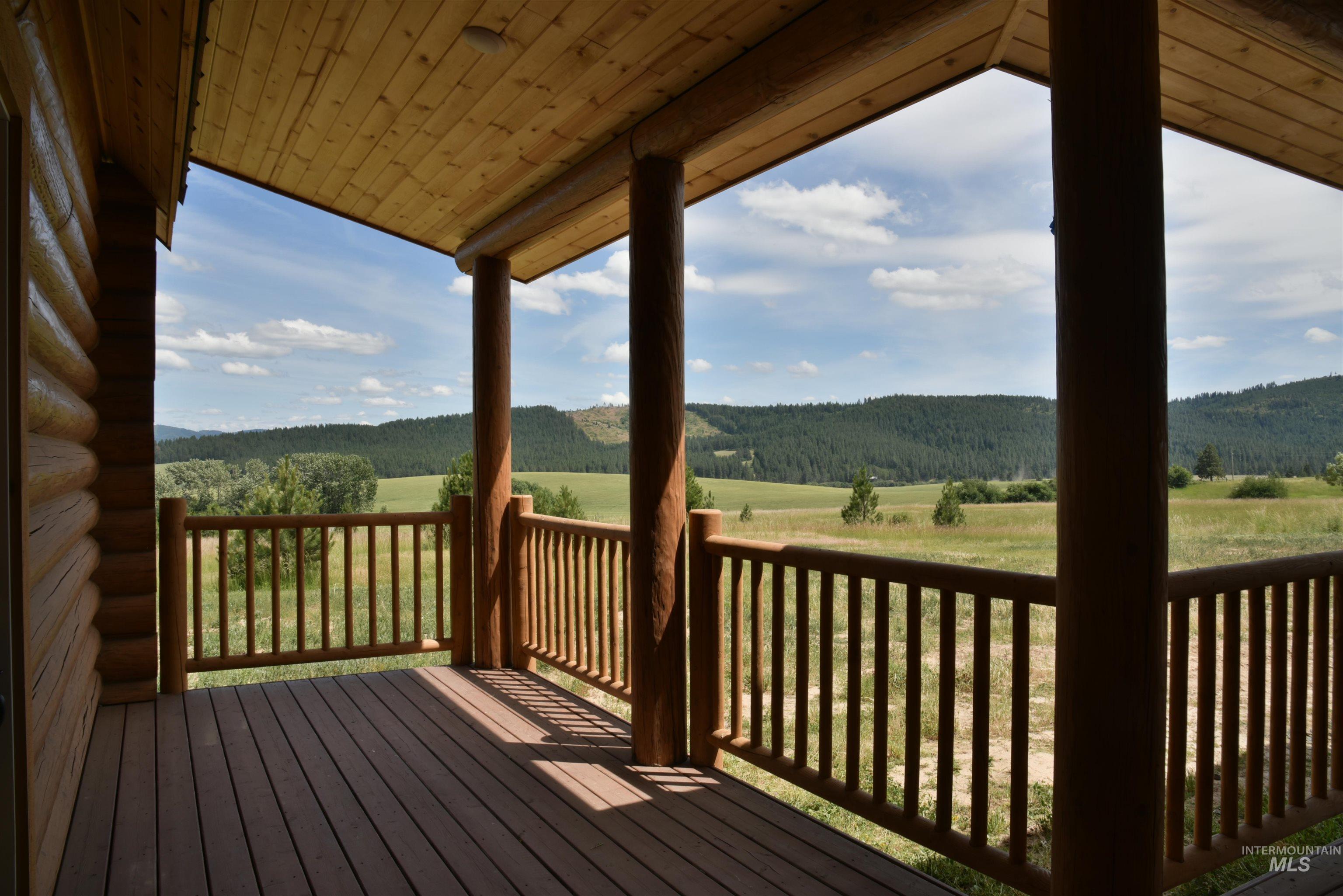 293 Vine Maple Desmet, ID 83824 - Photo 19 of 23 Wooden terrace featuring a view of trees