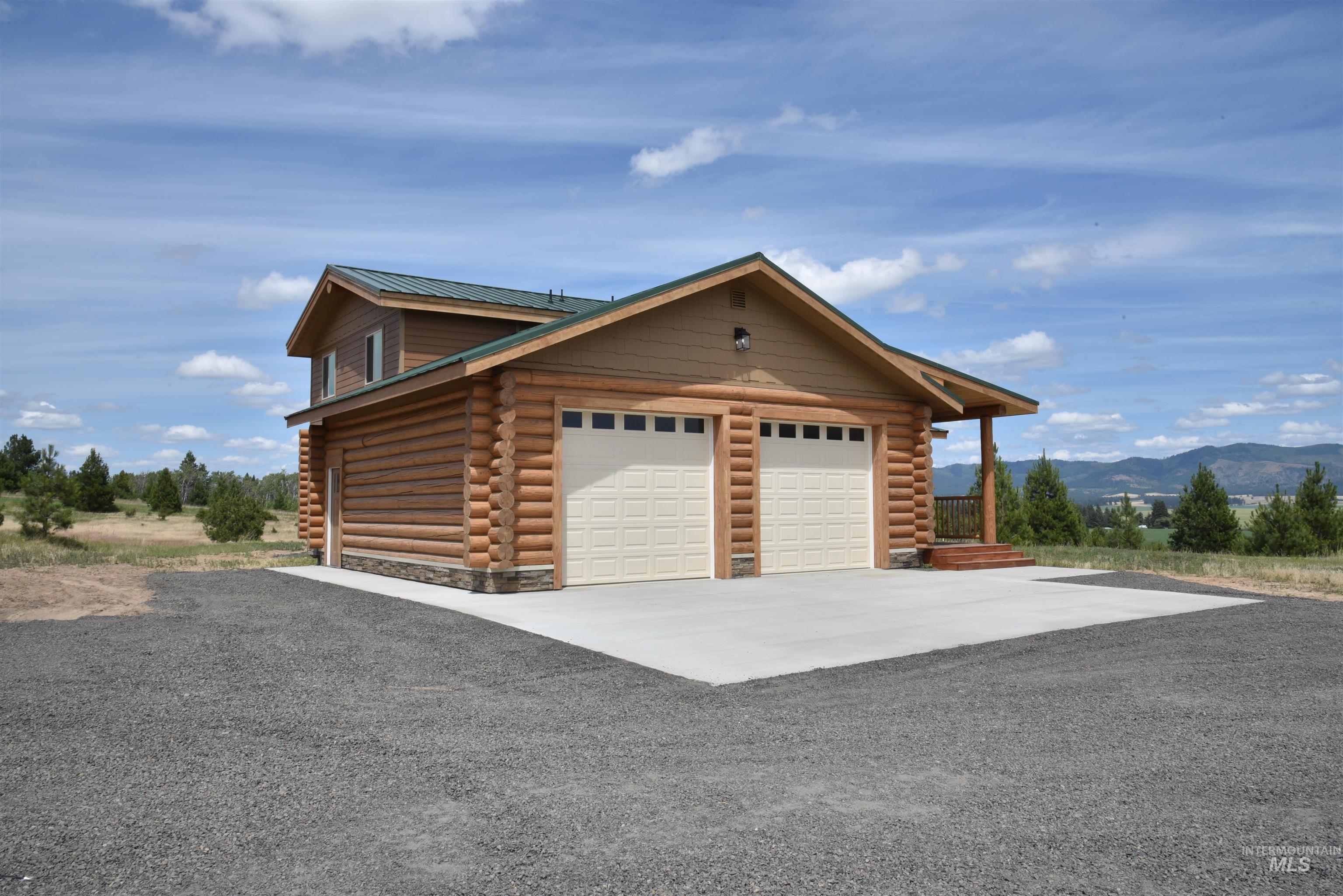 293 Vine Maple Desmet, ID 83824 - Photo 5 of 23 Garage with driveway and a mountain view