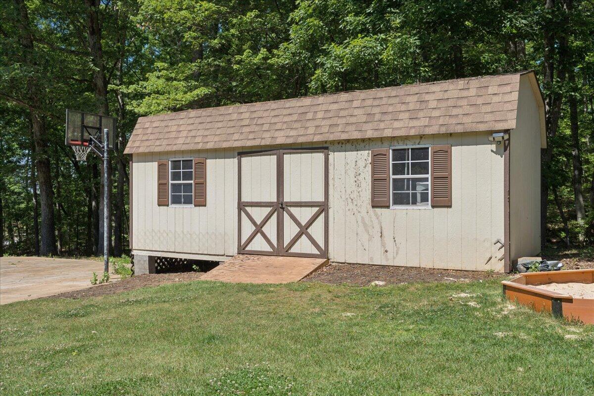 431 Langdon Road Evington, VA 24550 - Photo 41 of 54 a backyard of a house with table and chairs