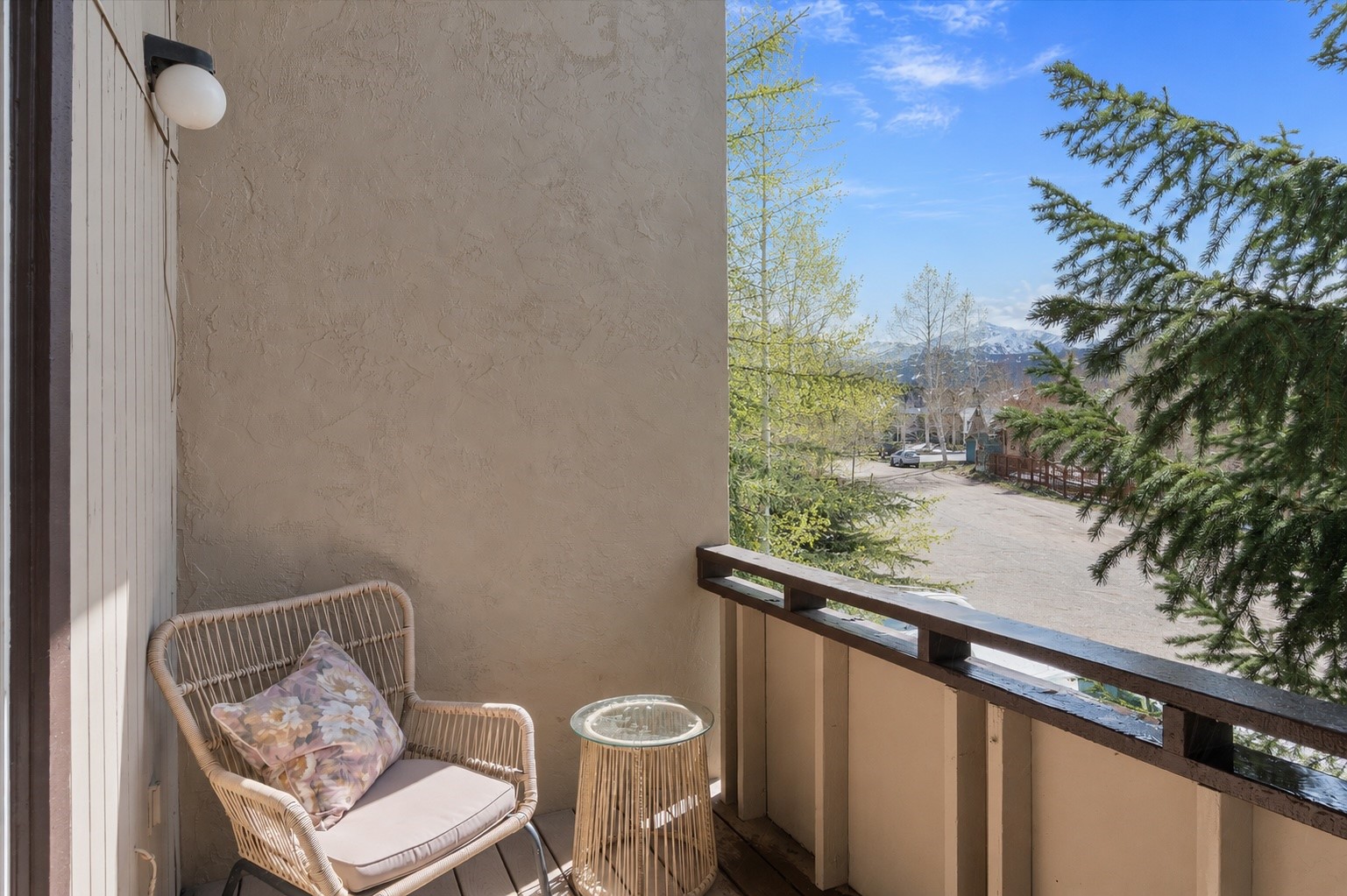 163 High Tor Road, Unit 7 Breckenridge, CO 80424 - Photo 14 of 42 a view of a balcony with chair and table