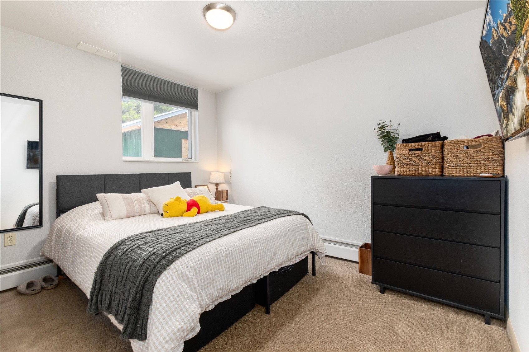 163 High Tor Road, Unit 7 Breckenridge, CO 80424 - Photo 29 of 42 a bedroom with a bed and a dresser
