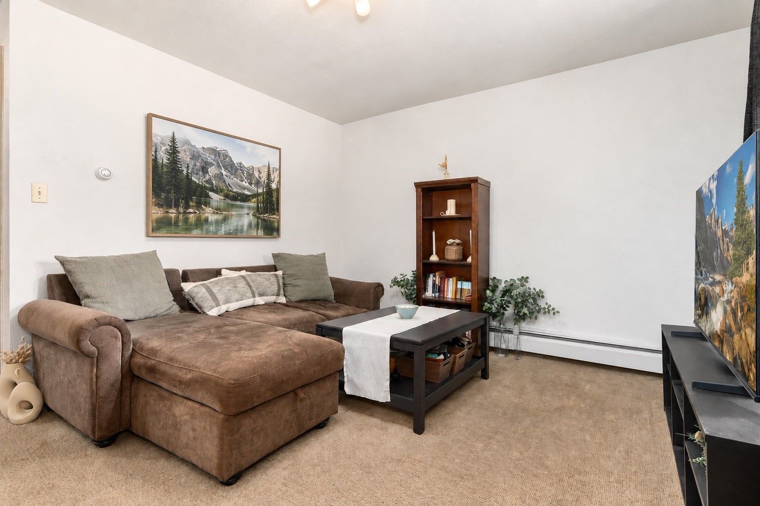 163 High Tor Road, Unit 7 Breckenridge, CO 80424 - Photo 31 of 42 a living room with furniture and a flat screen tv
