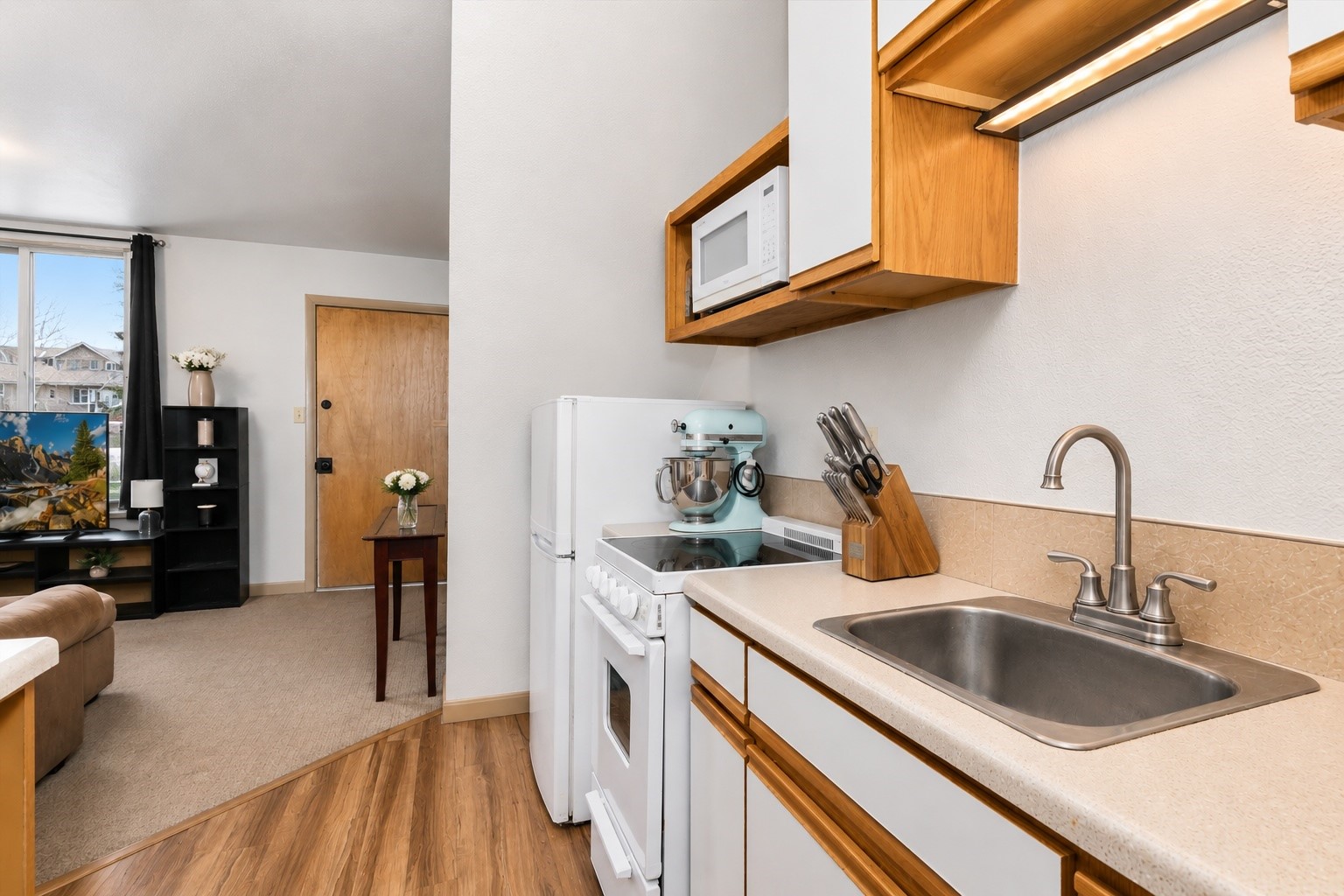 163 High Tor Road, Unit 7 Breckenridge, CO 80424 - Photo 33 of 42 a kitchen with stainless steel appliances granite countertop a sink stove and cabinets
