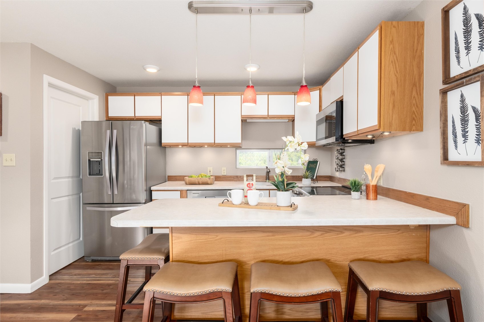 163 High Tor Road, Unit 7 Breckenridge, CO 80424 - Photo 10 of 42 a kitchen with stainless steel appliances kitchen island granite countertop a table chairs and a refrigerator