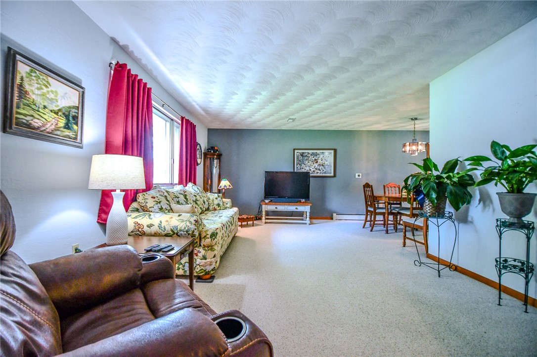10833 Kendig Road Medway, OH 45341 - Photo 10 of 46 This inviting living space features an open layout, ideal for both relaxation and entertaining.