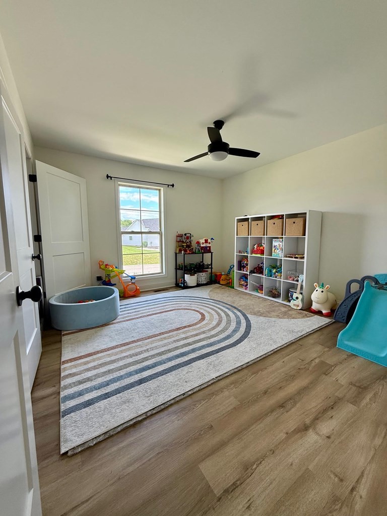 2617 Spring Arbor Court Cookeville, TN 38501 - Photo 12 of 32 a bedroom with a bed and a chandelier