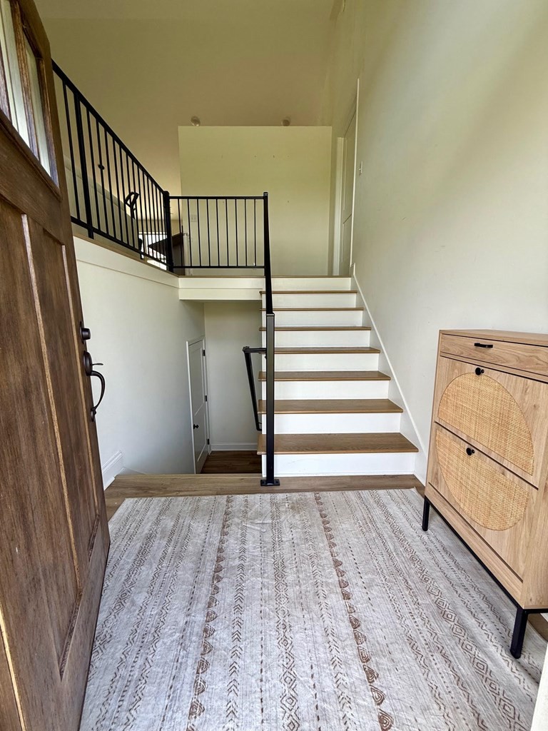 2617 Spring Arbor Court Cookeville, TN 38501 - Photo 18 of 32 a view of a hallway with wooden floor and staircase