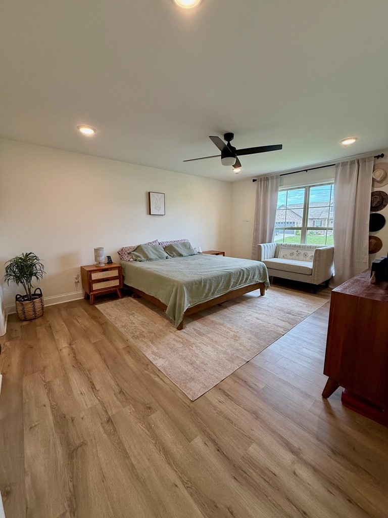 2617 Spring Arbor Court Cookeville, TN 38501 - Photo 19 of 32 a living room with a bed furniture and a wooden floor