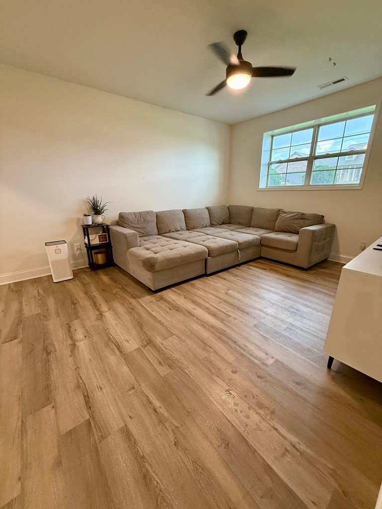 2617 Spring Arbor Court Cookeville, TN 38501 - Photo 22 of 32 a living room with furniture and a chandelier