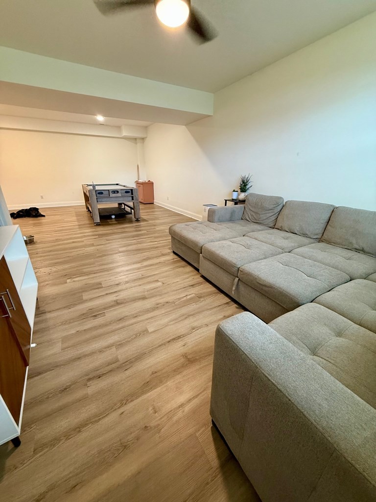2617 Spring Arbor Court Cookeville, TN 38501 - Photo 23 of 32 a living room with furniture and a flat screen tv
